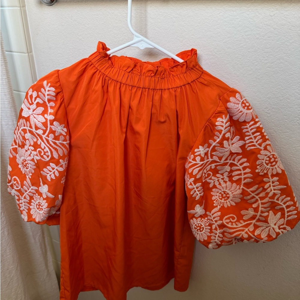 Orange Blouse with White Embroidery